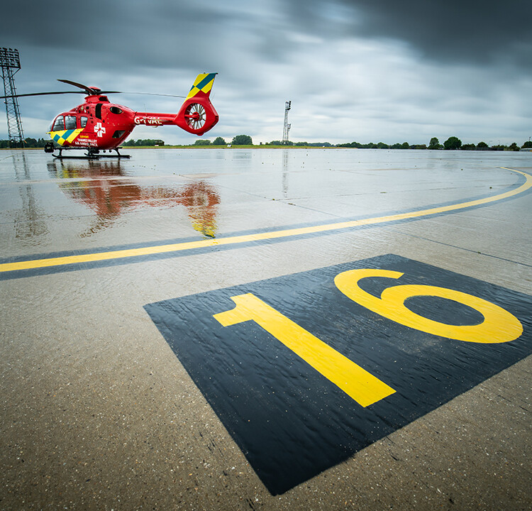 tvaa red helicopter on helipad