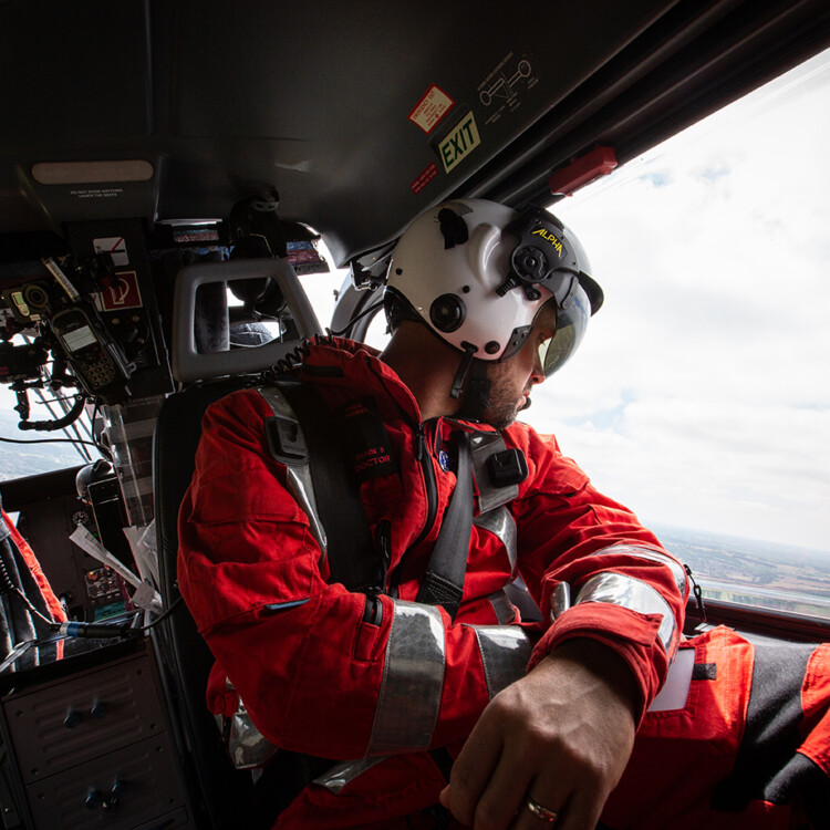 tvaa doctor looking out of helicopter window while in flight