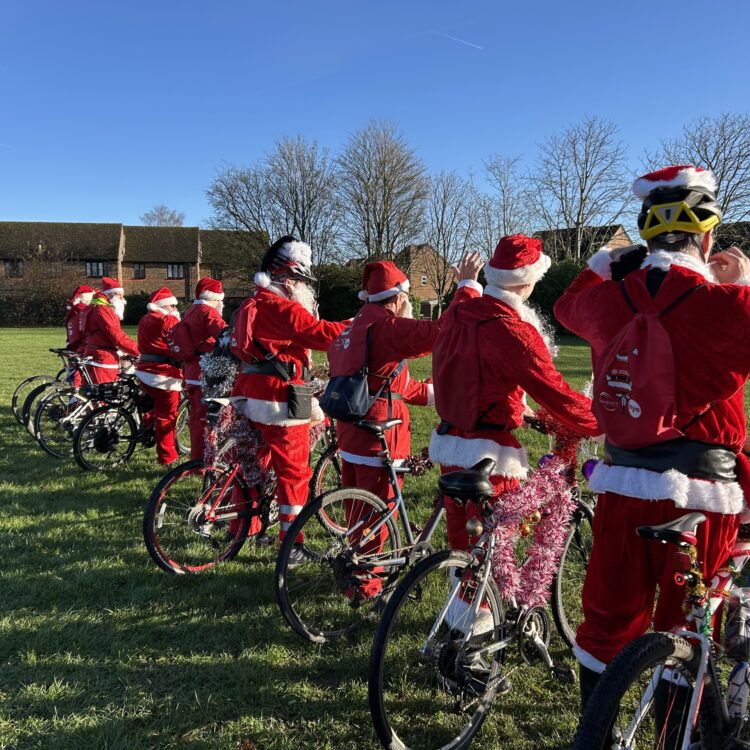Supporters dressed up as Santa set off on a bike ride