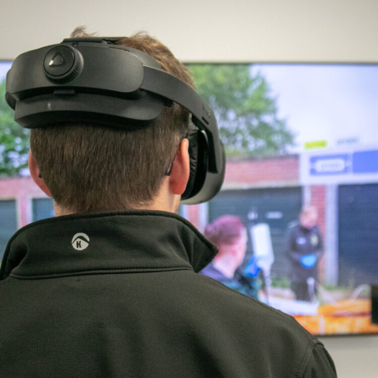 A Thames Valley Air Ambulance critical care paramedic using a virtual reality headset for training.