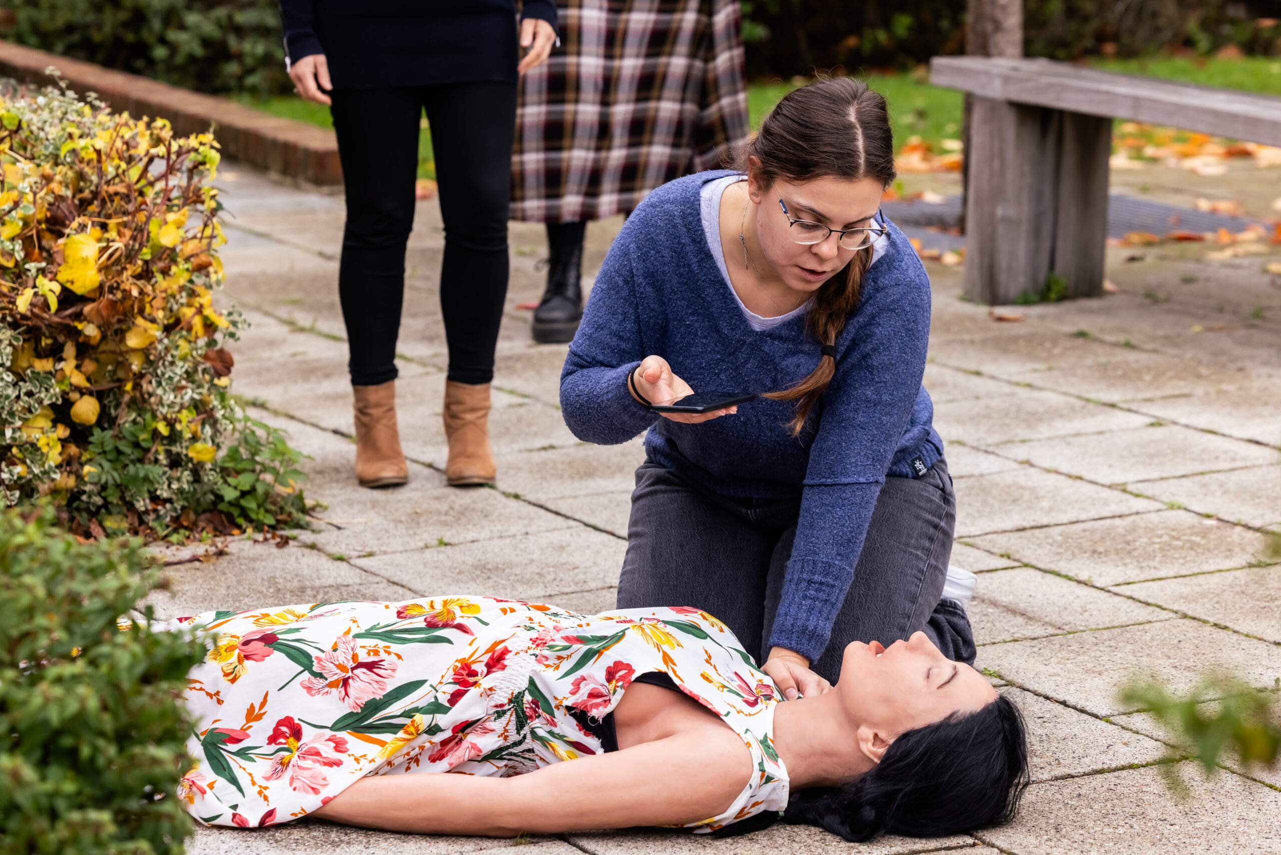 Bystander approaching casualty ready to perform CPR