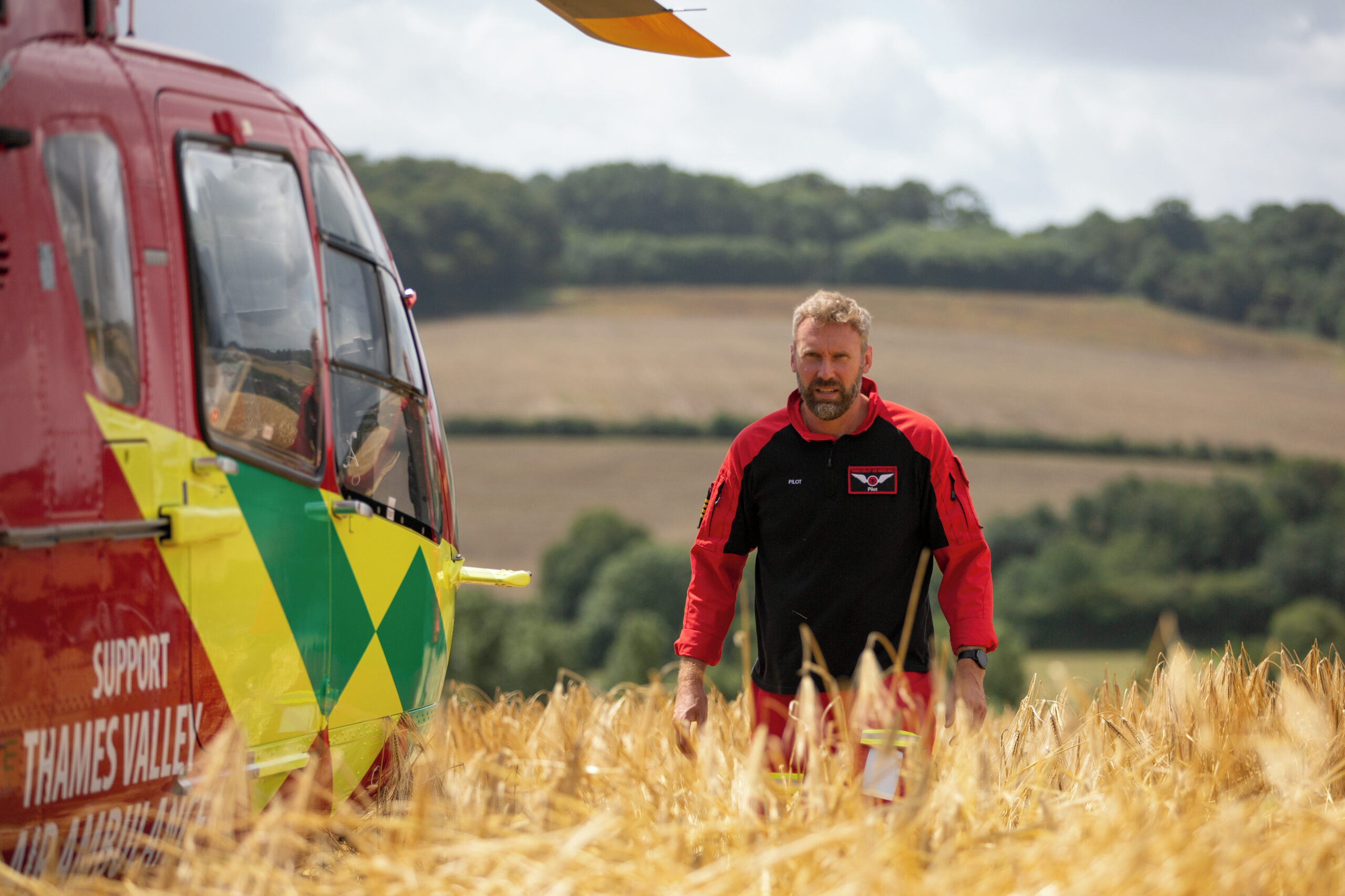 Pilot James Hamilton by the helicopter G-TVLY
